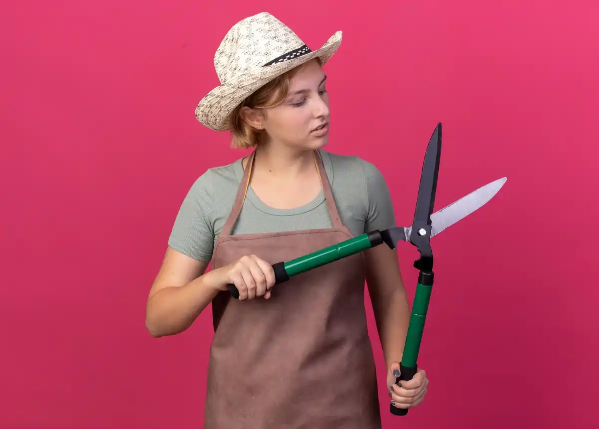 gardener holding fork hand using it as gardening tool Czech garden