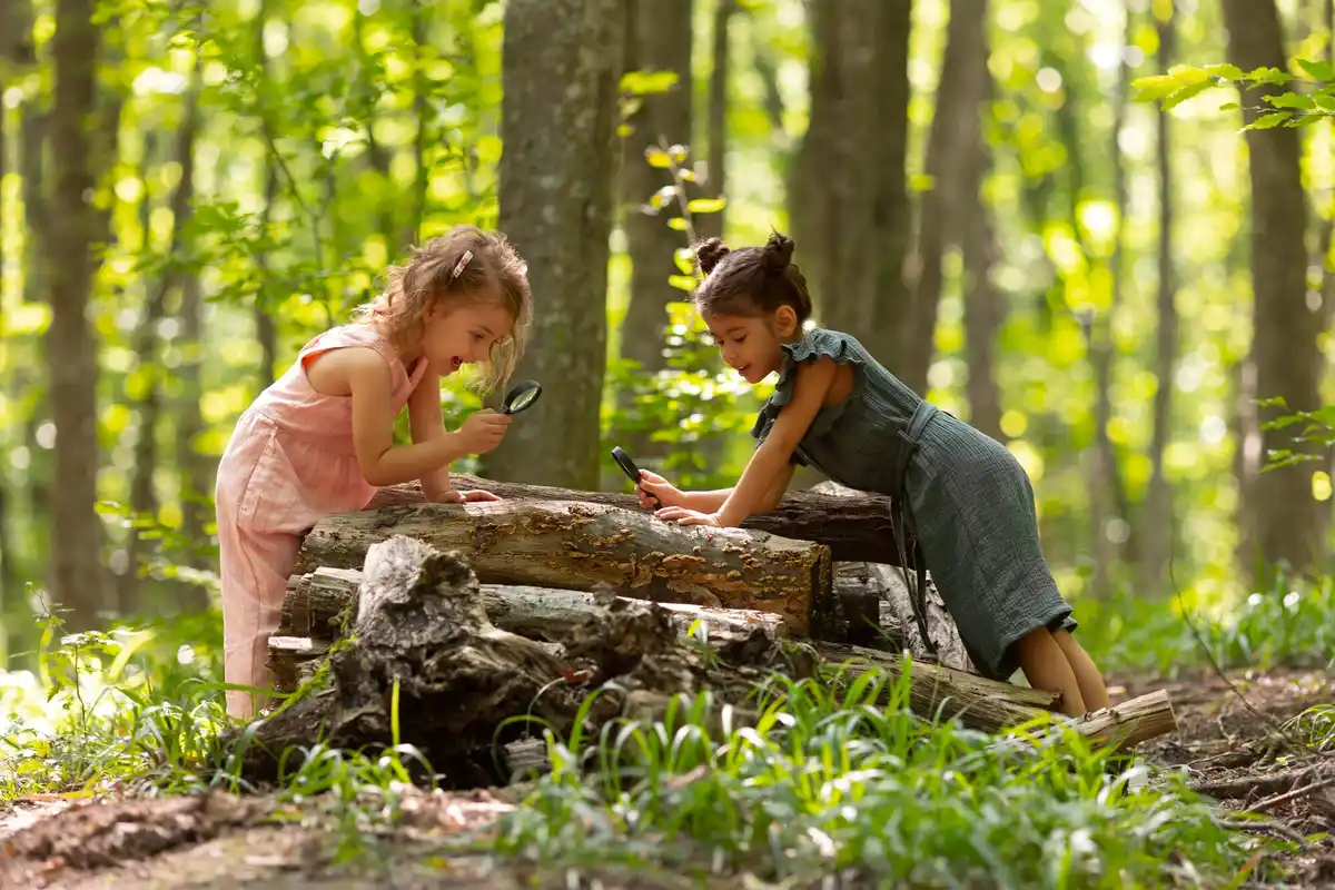 Czech kids exploring wild meadow backyard