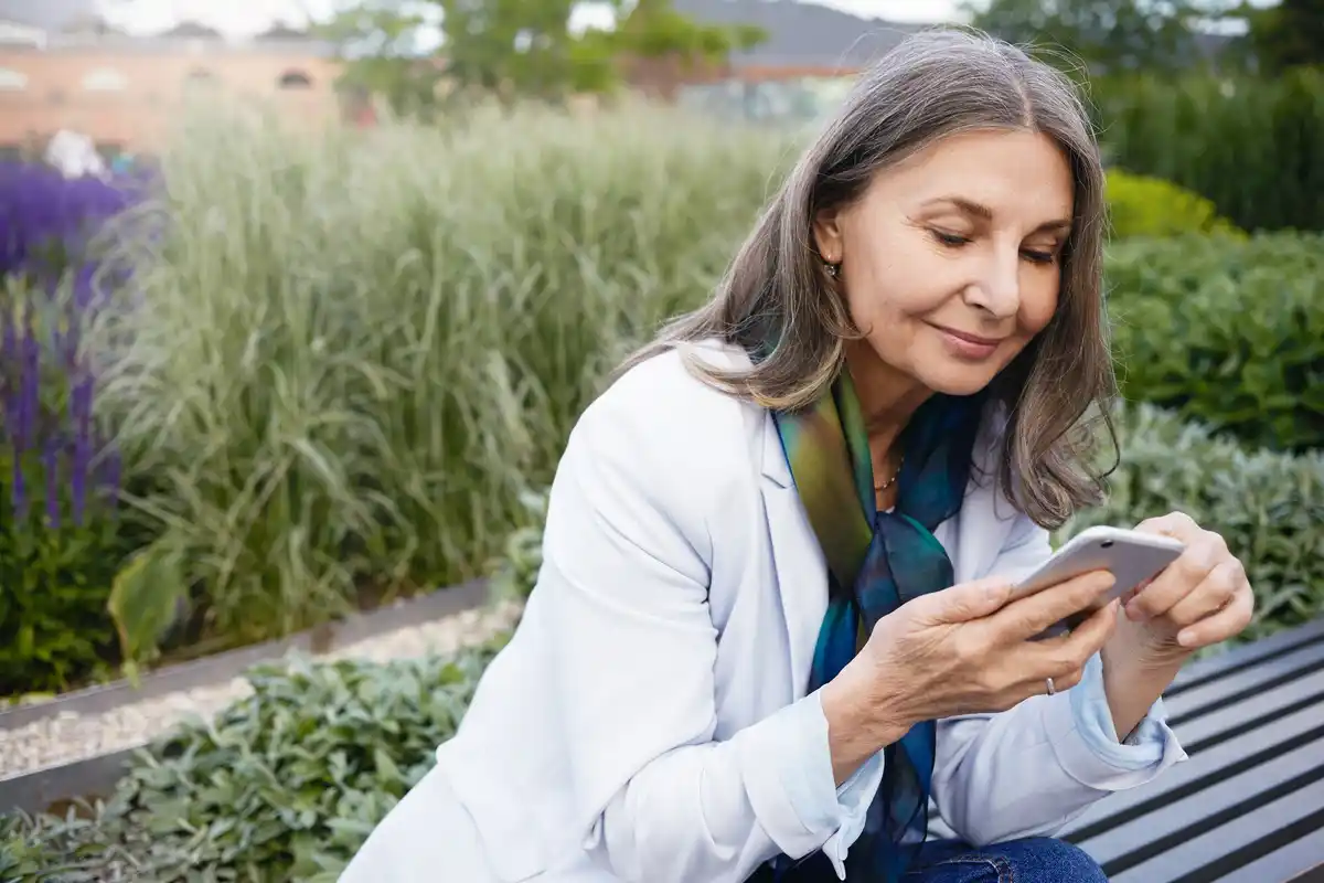 czech elderly woman using smart greenhouse app