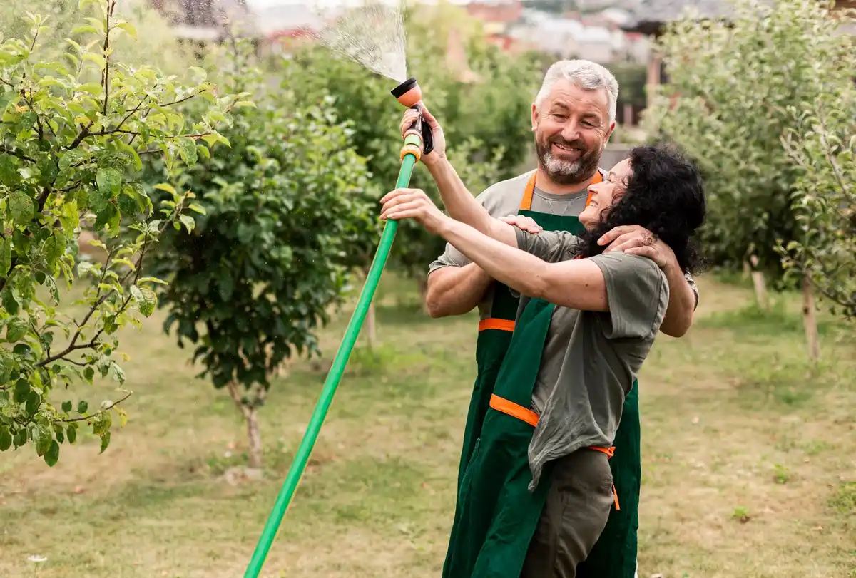 elderly hands gardening Czech fruit garden