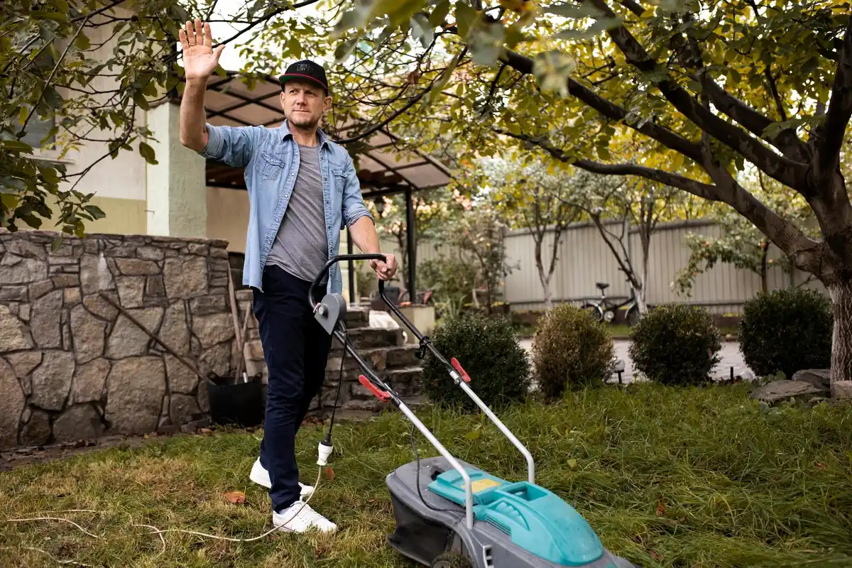 Czech man DIY repairing lawn mower garage tool
