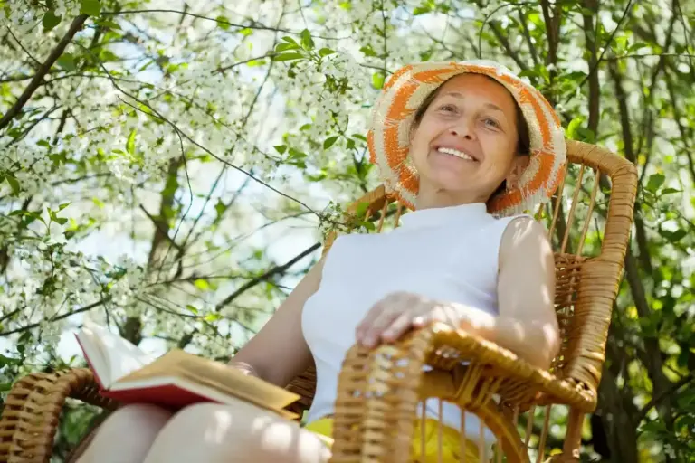 elderly relaxing in lush mulched czech garden summer