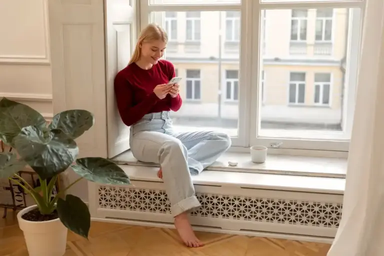 houseplant on window sill with radiator