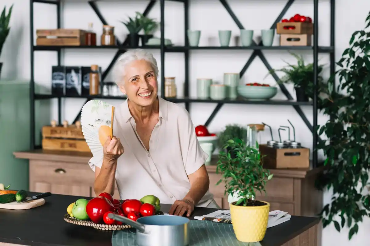 Czech senior with lemon tree in flat kitchen