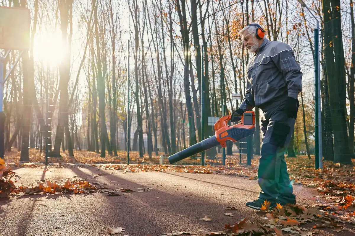 elderly man using cordless garden tool czech seniors