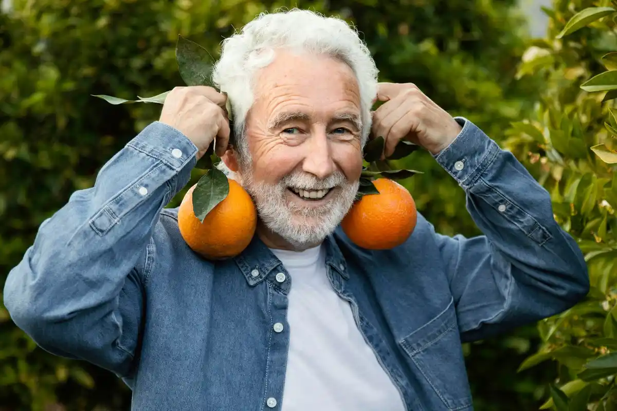 senior man growing lemons indoors Czech Republic
