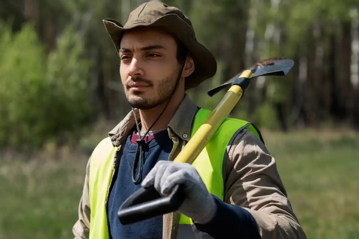 czech man using string trimmer protective equipment