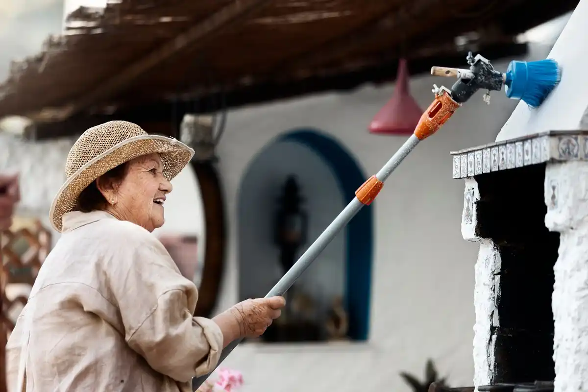 czech grandmother cleaning old garden tools backyard