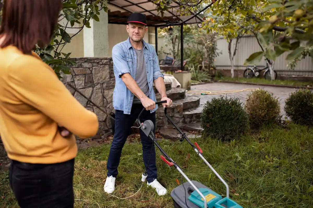 manual reel lawn mower on czech grass backyard