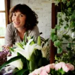 women over 50 in modern Czech home with indoor live flowers