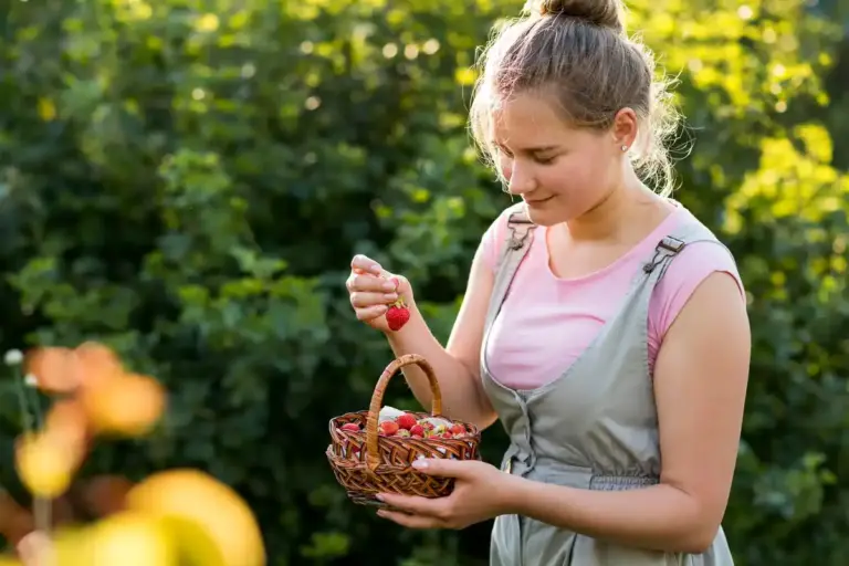 traditional Czech grandmother gardening strawberries