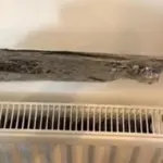 Alobal za radiátorem: Geniální trik, který sníží účet za topení o 25%